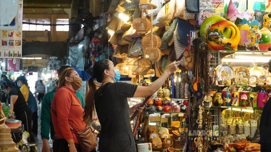 Largest traditional market in HCM City bustling again after Tet 