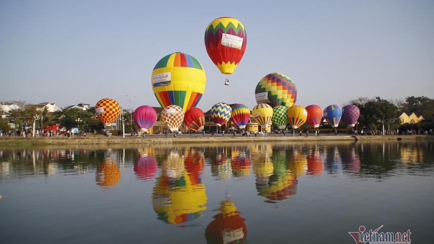 Hot-air balloons colour sky over Hoi An Ancient Town
