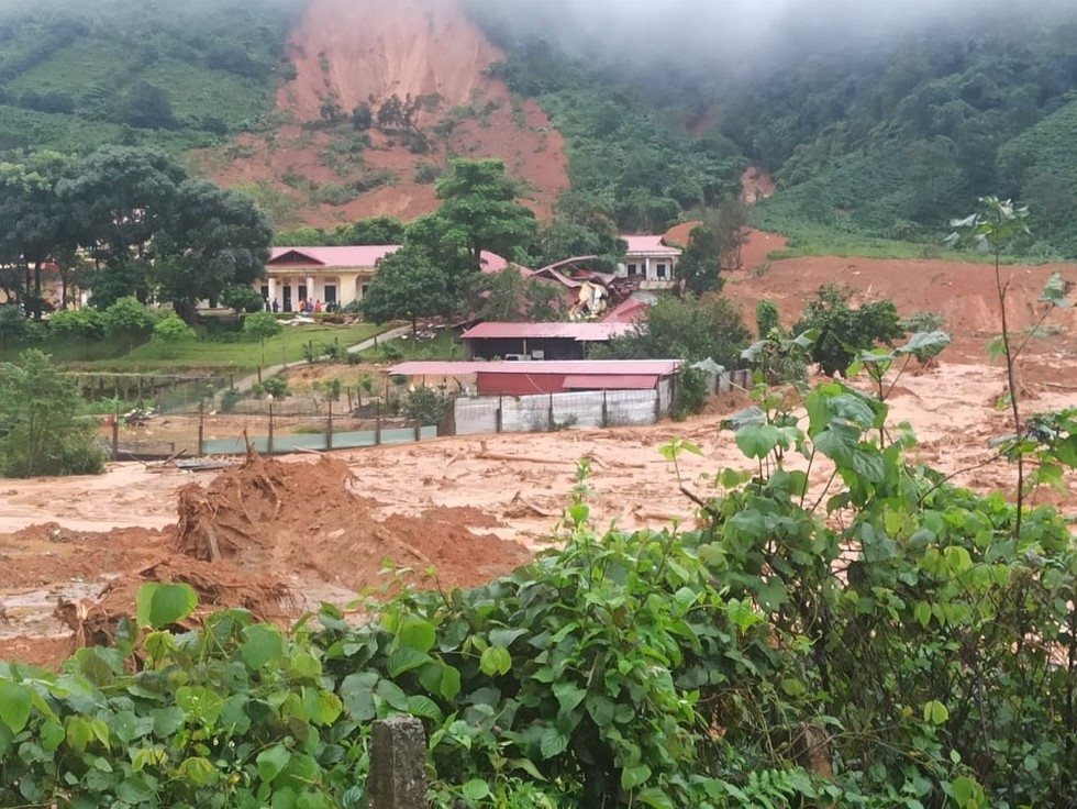Another landslide leaves dozens buried in mud in central Vietnam