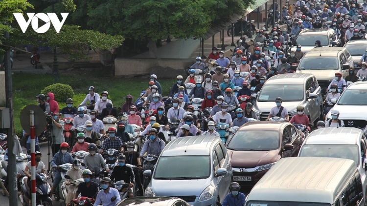 Hanoi streets busy on first day of COVID-19 restrictions being eased
