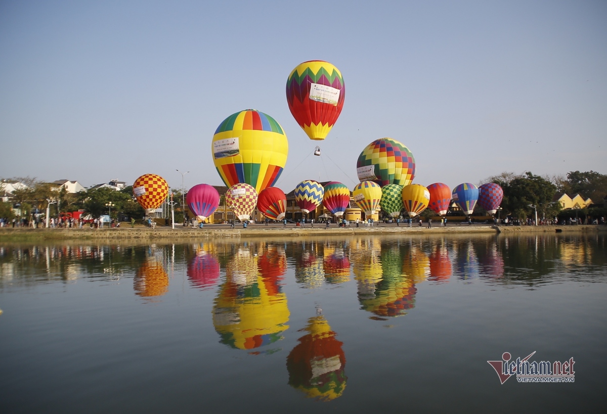 Hot-air balloons colour sky over Hoi An Ancient Town