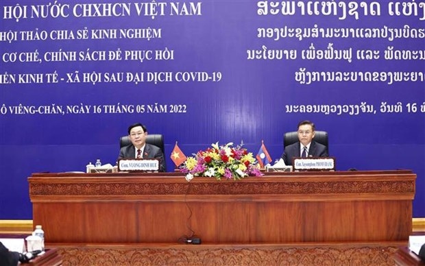 Vietnamese, Lao NAs share experience in designing socio-economic recovery policies