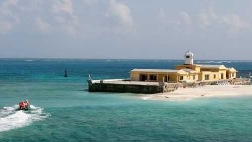 Students look towards sea, islands