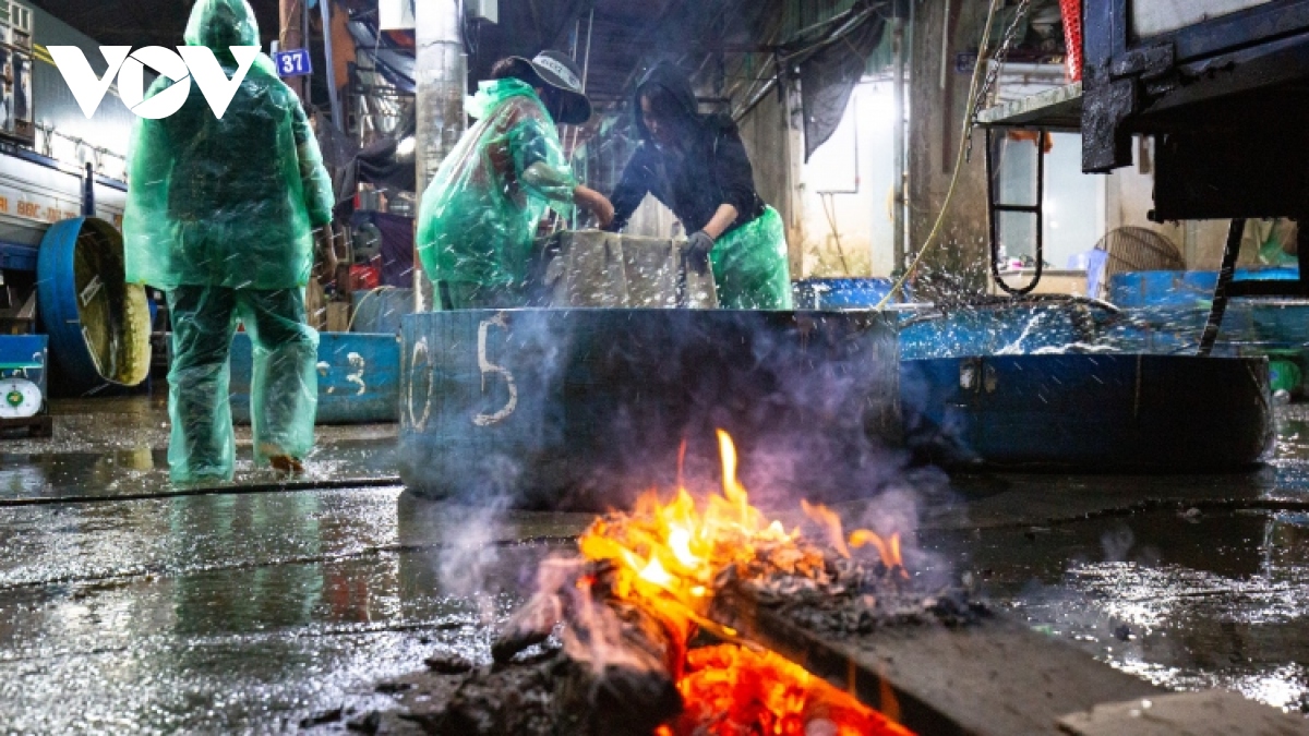 Hanoi's outdoor workers make a living on freezing cold nights